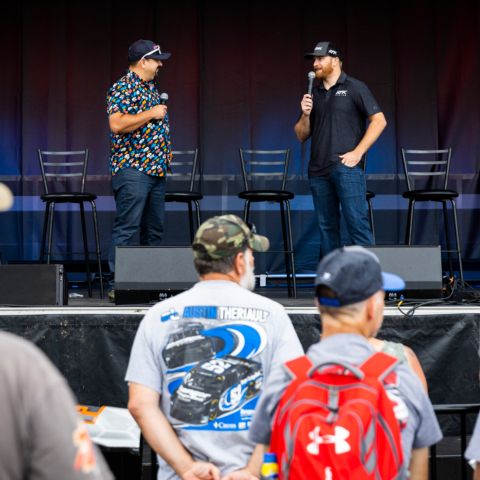 NASCAR Cup Series driver Chris Buescher (right) chats on stage with host Jose Castillo (left) during New Hampshire Motor Speedway’s 2023 NASCAR weekend.