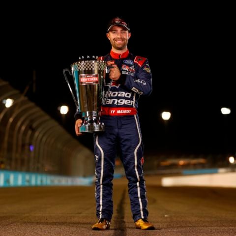 Ty Majeski, driver of the No. 98 ThorSport Racing Ford, poses with the NASCAR CRAFTSMAN Truck Series Champions trophy after winning the NASCAR CRAFTSMAN Truck Series Championship Race at Phoenix Raceway on Nov. 8, 2024 in Avondale, Ariz.